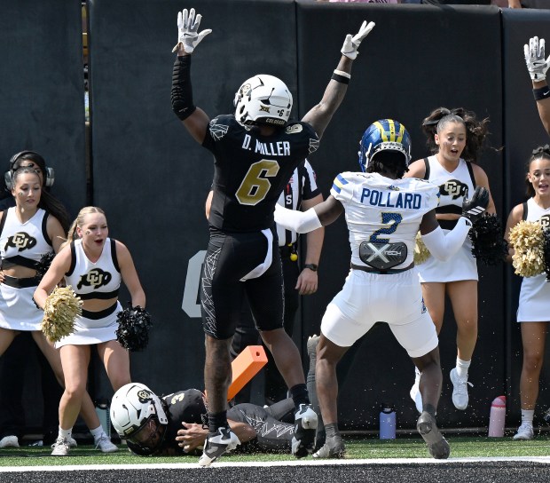 Colorado Buffaloes receiver Dre’lon Miller (6) celebrates the touchdown run...