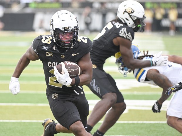 Colorado Buffaloes running back Micah Welch scores a touchdown against...