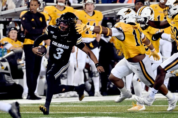 University of Colorado Buffaloes, Colorado quarterback Kaidon Salter (3) tries...