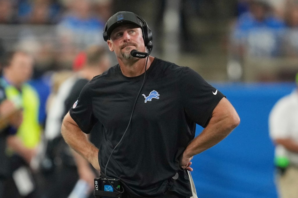 Lions coach Dan Campbell on the sidelines during a football game.