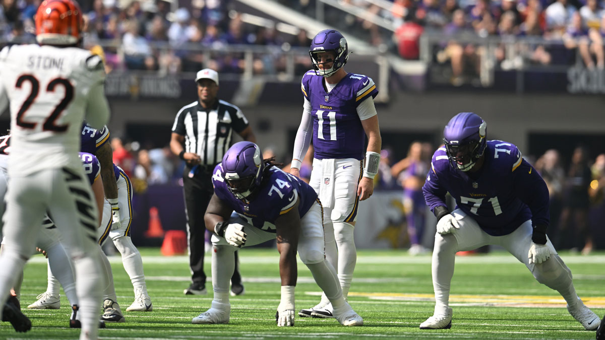 Minnesota Vikings quarterback Carson Wentz (11) walks up to the line of scrimmage during the first half against the Cincinnati Bengals at U.S. Bank Stadium. 