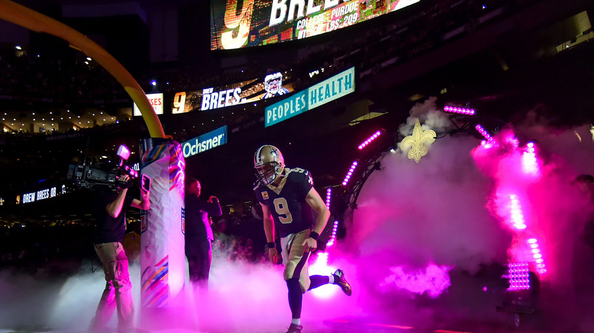 Drew Brees running out of the tunnel before New Orleans Saints game.