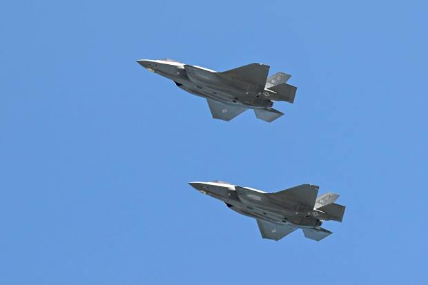 Alex Abbott, a former Carpentersville resident, was piloting one of two 115th Fighter Wing planes that flew over Chicago's Soldier Field on Sept. 8 prior to the Chicago Bears/Minnesota Vikings football game. The planes are part of the Air National Guard stationed in Madison, Wisconsin. (Wisconsin National Guard)