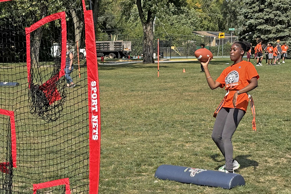 A student tests her passing ability during the Monsters Flag Football program Sept. 19 at Hart School. (Marilyn Thomas/H-F Chronicle)