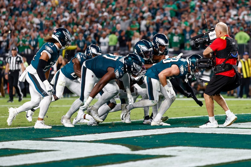 The Philadelphia Eagles defense celebrates a forced fumble with a “Tush Push” during the...