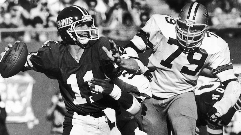 1979 -- Harvey Martin, shown zeroing in on Giants quarterback Phil Simms, played for the...