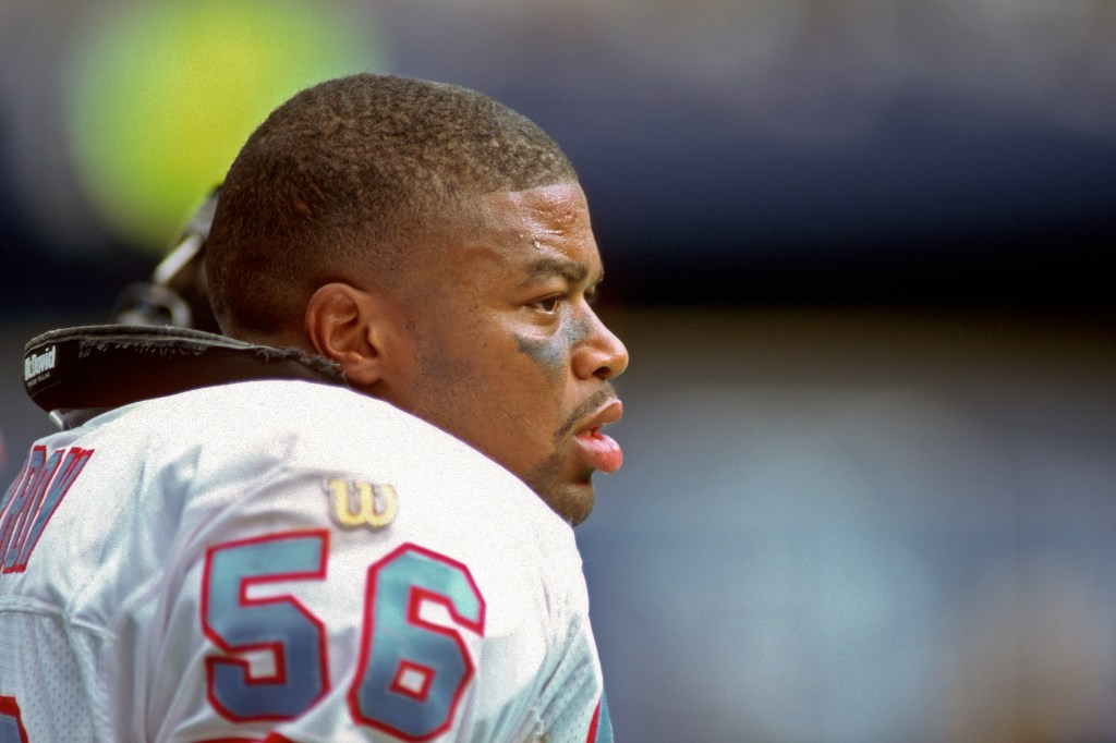 Linebacker Micheal Barrow #56 of the Houston Oilers looks on from the sideline 