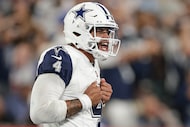 Dallas Cowboys quarterback Dak Prescott (4) reacts after throwing a touchdown pass against...