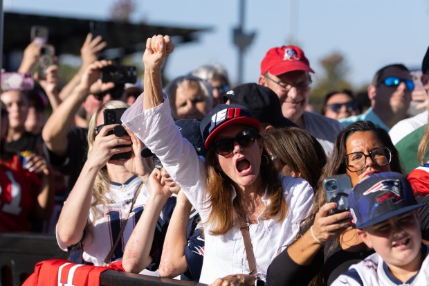 Patriots fans cheer during the Hall of Fame induction ceremony...