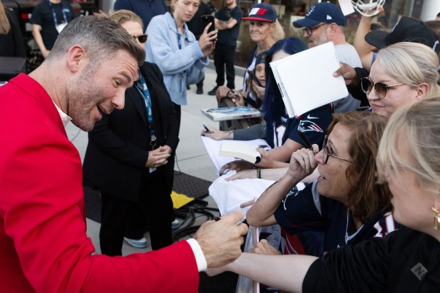 Julian Edelman signs a fan's arm after his Patriots Hall...