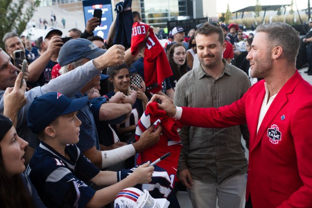 Julian Edelman signs autographs for fans after his Patriots Hall...