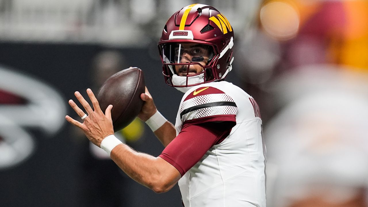 Washington Commanders quarterback Marcus Mariota looked to throw against the Atlanta Falcons on Sunday in Atlanta.