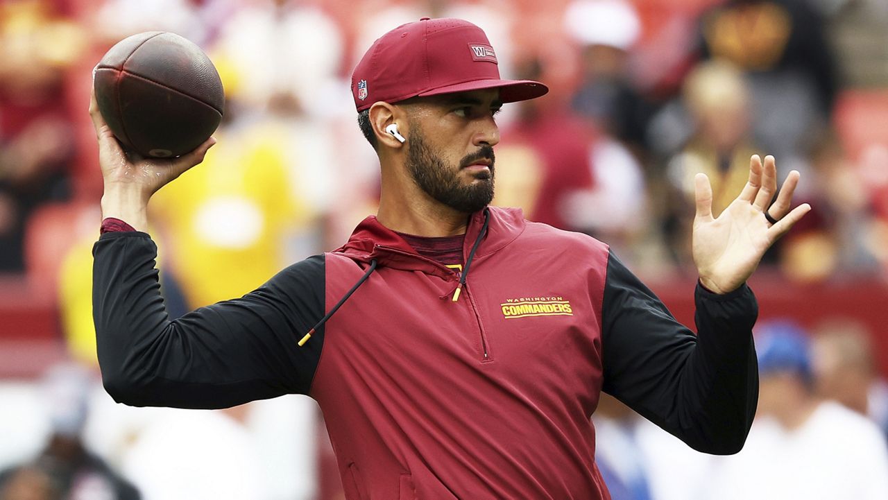 Washington quarterback Marcus Mariota warmed up before the Commanders game against the New York Giants on Sept. 7.