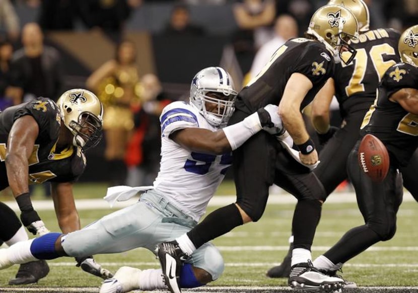Game 14-Cowboys 24, Saints 17: Dallas Cowboys linebacker DeMarcus Ware (94) causes New...
