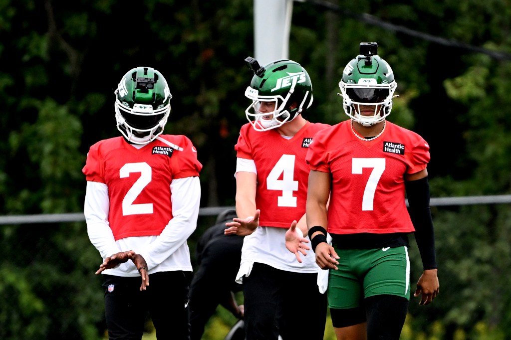 Brady Cook, Tyrod Taylor, and Justin Fields in Jets practice uniforms.