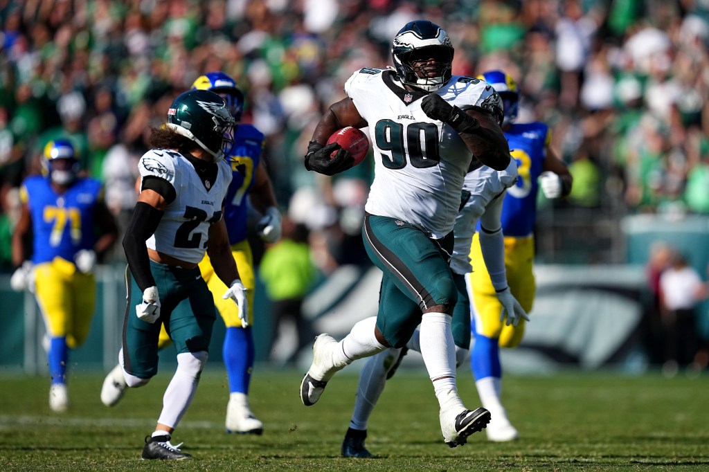Philadelphia Eagles player Jordan Davis #90 carrying the football during a game against the Los Angeles Rams.