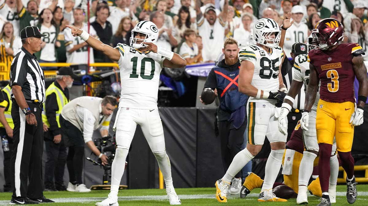 Green Bay Packers quarterback Jordan Love (10) reacts after a first down against the Washington Commanders in the first quarter at Lambeau Field.