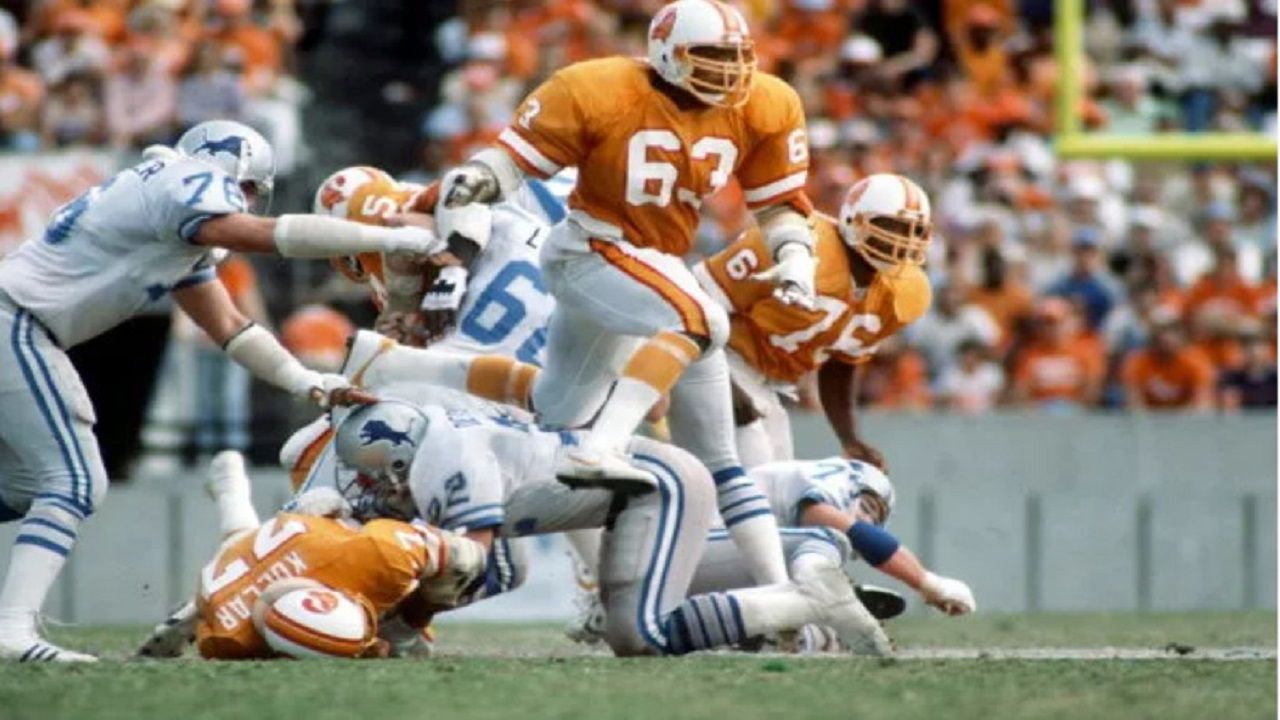 Tampa Bay's first draft pick in franchise history, Lee Roy Selmon (63) terrorized ball carriers and quarterbacks from 1976 to 1984 en route to the Pro Football Hall of Fame. (Getty Images/Michael J. Minardi)