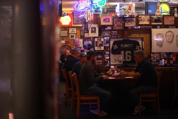 Owner Tim Harrison walks through the Canyon Inn restaurant on Monday, July 21, 2025, in Redwood City, Calif. The Canyon Inn restaurant used to be just down the street from 49ers practice facility, and the team had been so bad that in 1981 they decided to offer free meals to players and staff following a win. That year turned out to be their first Super Bowl season. (Aric Crabb/Bay Area News Group)