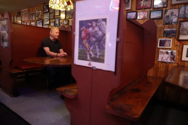 Owner Tim Harrison sits in a booth the Canyon Inn restaurant on Monday, July 21, 2025, in Redwood City, Calif. The Canyon Inn restaurant used to be just down the street from 49ers practice facility, and the team had been so bad that in 1981 they decided to offer free meals to players and staff following a win. That year turned out to be their first super bowl season. (Aric Crabb/Bay Area News Group)