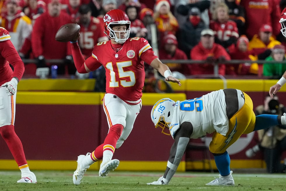Kansas City Chiefs quarterback Patrick Mahomes (15) looks to pass as Los Angeles Chargers...