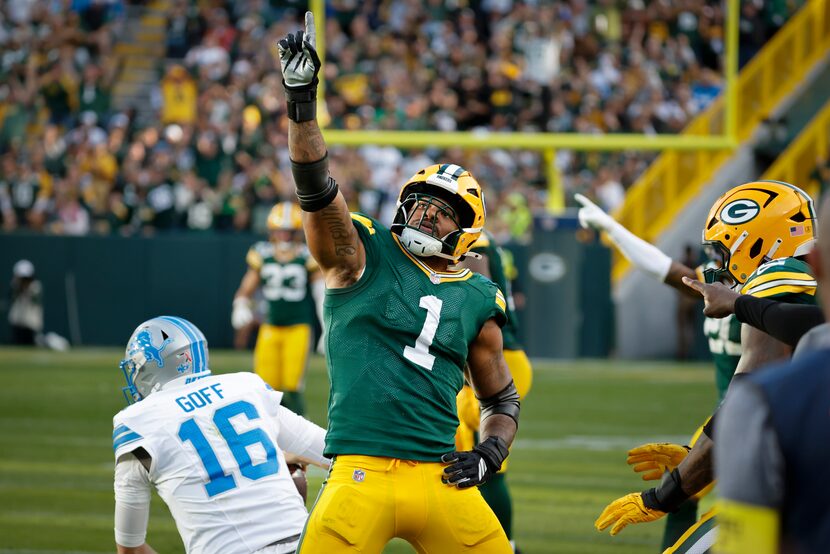 Green Bay Packers defensive end Micah Parsons celebrates his first sack for the Packers...