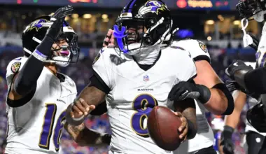 Baltimore Ravens quarterback Lamar Jackson (8) celebrates with wide receiver Tylan Wallace (16) after a touchdown against the Buffalo Bills during the first half at Highmark Stadium.