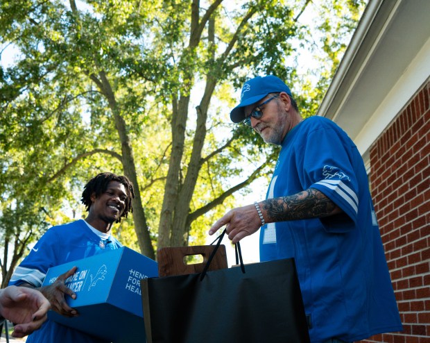 Tailgate in a Box recipient and Detroit Lions wide receiver Jameson Williams (1) during a "Tailgate in a Box" surprise visit on Sept. 26, 2025 in Taylor, MI. (Izzy Rincon/Detroit Lions)