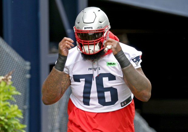 New England offensive tackle Morgan Moses enters the field as the Patriots hold practice outside Gillette Stadium. (Staff Photo By Stuart Cahill/Boston Herald)