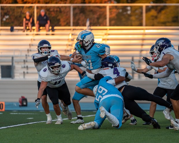 Pleasant Valley High’s Conner Witzel (21) runs the ball up...