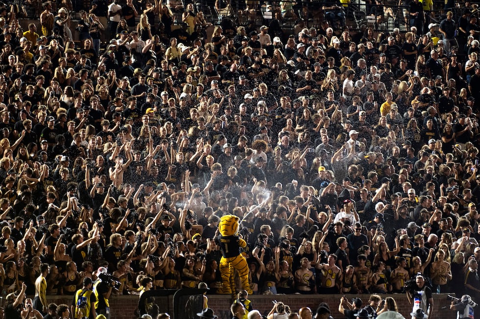 The Missouri mascot sprays fans with water during the second half of an NCAA college football...