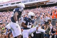 Penn State running back Kaytron Allen (13) celebrates after a touchdown with tight end...