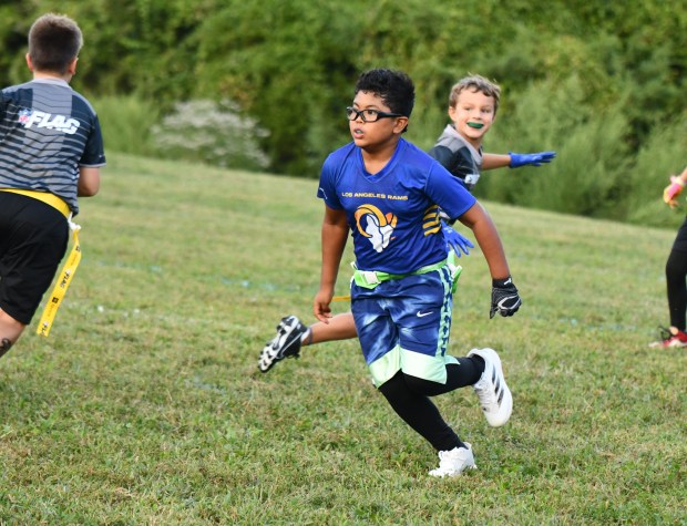 Rams Justin Comia charges across the line on a blitz....