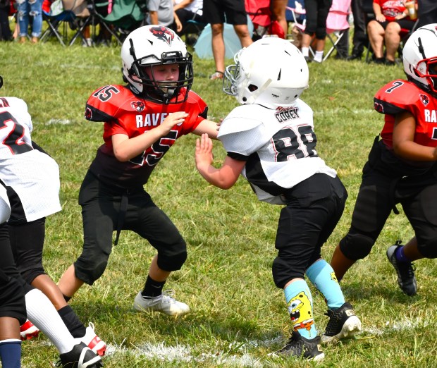 Bryce Corey tries to keep Fox Rox’s Joe Getter at...