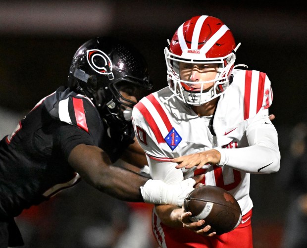 Centennial's Jonathan McKinley II (12) sacks Mater Dei quarterback Ryan Hopkins (10) during the first half at Centennial High School in Corona on Friday, Sep. 12, 2025. Centennial hosts Mater Dei in a nonleague football game. (Photo by Will Lester, Inland Valley Daily Bulletin/SCNG)