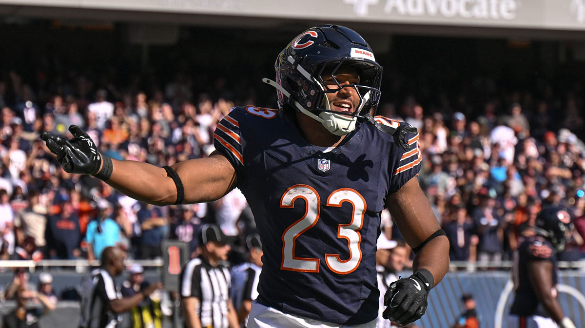 Chicago Bears running back Roschon Johnson (23) celebrates a rushing touchdown against the Carolina Panthers during the fourth quarter at Soldier Field.