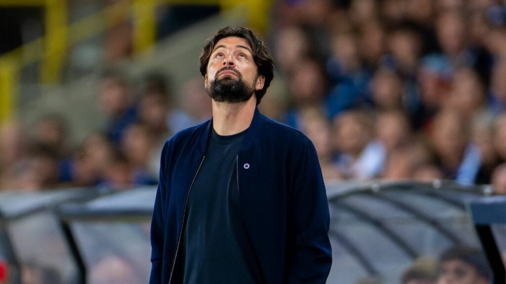 Rangers manager Russell Martin stares at the sky during a game.