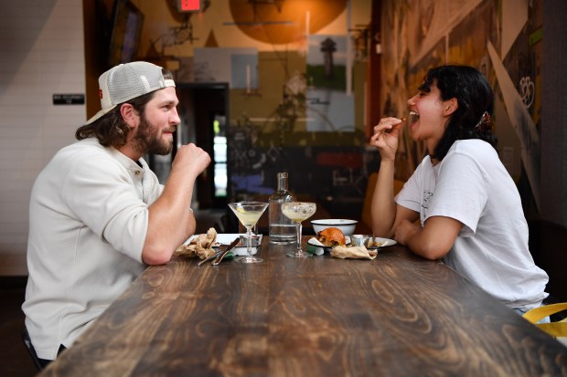 Stuart Swanson, of El Cerrito, chats with Olivia Ventura, of Berkeley, while having lunch at the Batch & Brine restaurant in Lafayette, Calif., on Friday, March 22, 2024. (Jose Carlos Fajardo/Bay Area News Group)
