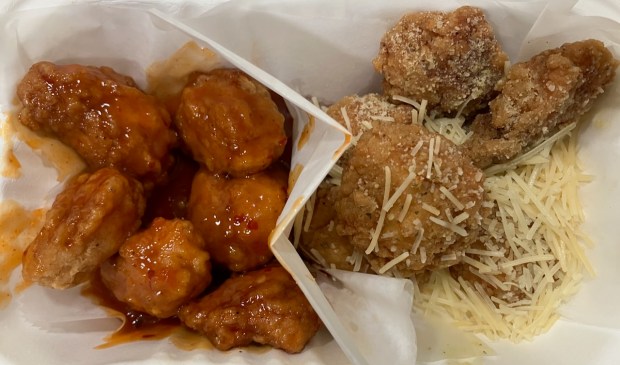 At Fire Wings, which has locations around the Bay Area, a wide array of wing customizations are available, with 20 different flavors, abundant dipping sauces and bone-in or boneless variants. These are boneless mango habanero and garlic parmesan wings. (Kate Bradshaw/Bay Area News Group)