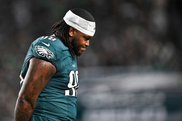 Philadelphia Eagles defensive tackle Jalen Carter (98) walks off the field after being ejected from the game during the first half of an NFL football game against the Dallas Cowboys, Thursday, Sept. 4, 2025, in Philadelphia. (AP Photo/Terrance Williams)
