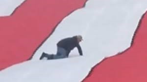 An unfortunate stadium employee finds himself at the wrong place at the wrong time before last Sunday's New York Jets game. (Screen grab from YouTube)