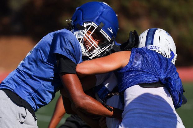 San Diego High's Kye Cooper, left, runs through drills during practice at Balboa Stadium on Wednesday, Sept. 3, 2025 in San Diego, CA. (Meg McLaughlin / The San Diego Union-Tribune)