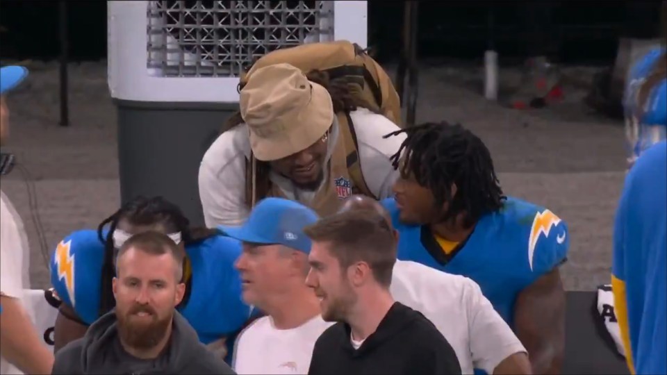 Screenshot of football players interacting.