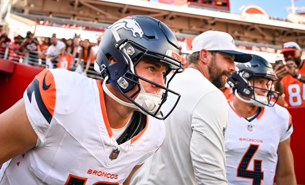 Bo Nix (10) of the Denver Broncos takes the field alongside Sam Ehlinger (4) before the first quarter of a preseason game against the San Francisco 49ers at Levi's Stadium in Santa Clara, California on Saturday, Aug. 9, 2025. (Photo by AAron Ontiveroz/The Denver Post)