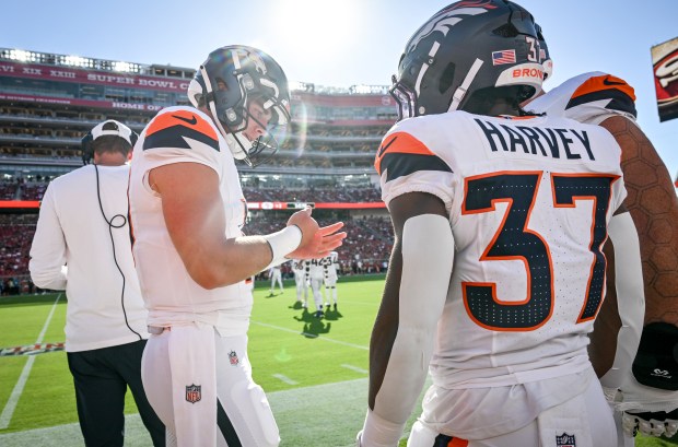 Bo Nix (10) of the Denver Broncos talks to RJ Harvey (37) of the Denver Broncos before facing the San Francisco 49ers defense during the first quarter at Levi's Stadium in Santa Clara, California, on Saturday, Aug. 9, 2025. (Photo by AAron Ontiveroz/The Denver Post)
