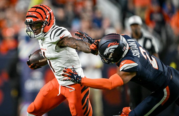 Ja'Marr Chase (1) of the Cincinnati Bengals stiff arms Pat Surtain II (2) of the Denver Broncos during the second quarter at Empower Field at Mile High on Monday, Sept. 29, 2025. (Photo by AAron Ontiveroz/The Denver Post)