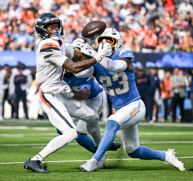 Tony Jefferson (23) of the Los Angeles Chargers breaks up a pass intended for Troy Franklin (11) of the Denver Broncos during the fourth quarter at SoFi Stadium in Inglewood, California on Sunday, Sept. 21, 2025. (Photo by AAron Ontiveroz/The Denver Post)