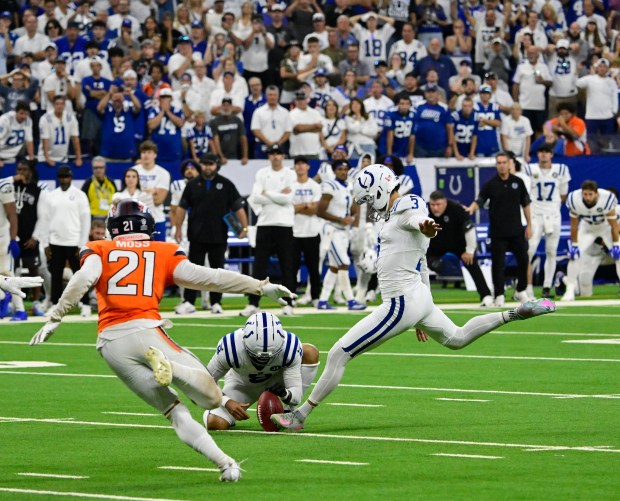 Indianapolis Colts place kicker Spencer Shrader (3) kicks the game-winning field goal against the Denver Broncos, winning 29-28 in the fourth quarter at Lucas Oil Stadium in Indianapolis, Indiana, on Sunday, Sept. 14, 2025. Indianapolis Colts punter Rigoberto Sanchez (8) holds for Shrader, Denver Broncos cornerback Riley Moss (21) tries to block it. (Photo by Andy Cross/The Denver Post)