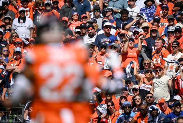 Denver Broncos cheer their team on against the Tennessee Titans...