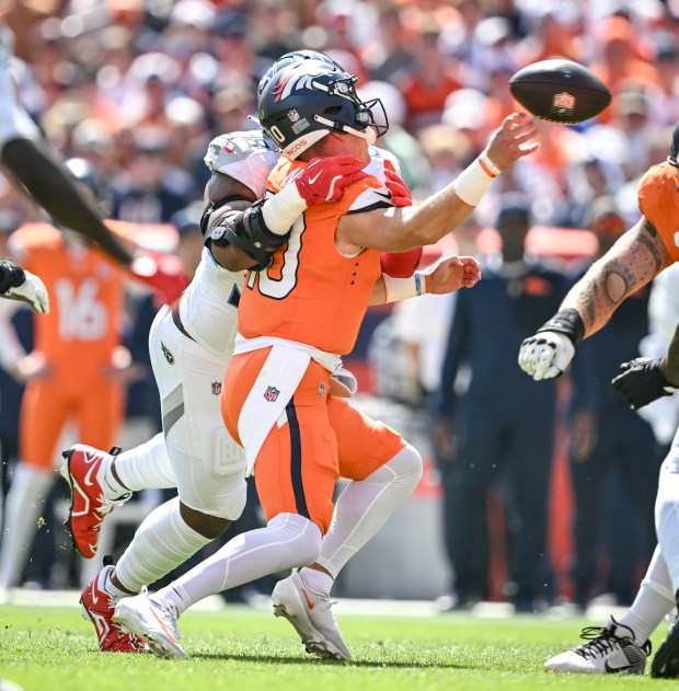 Jeffery Simmons (98) of the Tennessee Titans blows up Bo Nix (10) of the Denver Broncos forcing an incompletion during the frist quarter at Empower Field at Mile High on Sunday, Sept. 7, 2025. (Photo by AAron Ontiveroz/The Denver Post)